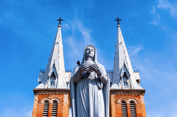 The Queen of Peace Statue in front of Notre Dame Cathedral in Ho Chi Minh City, Vietnam. The statue...