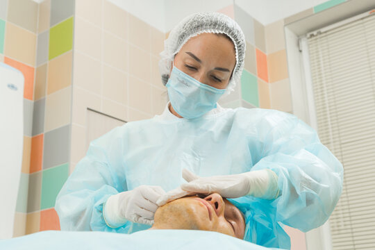 Woman doctor makes mesothreads and thread lifting patient to man Cosmetic procedure 