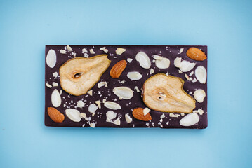 Natural handmade chocolate close-up on a bright background.