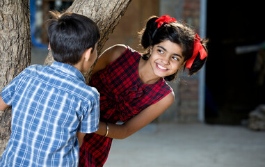 boy with girl playing hide and seek