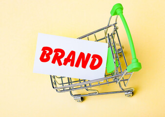 The card with the words BRAD is in the shopping cart. Marketing concept