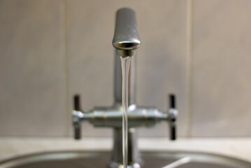 mixer tap with flowing water
