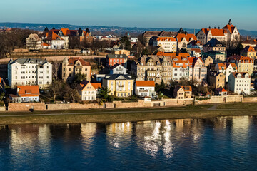 Obraz premium Meissen,Saxony, Germany. 17.02. 2019, .view from the hill to the Meissen embankment in sunny weather in early spring trees without leaves. no people