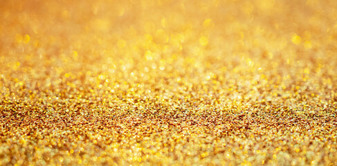Abstract gold glitter sparkle with bokeh background