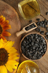 Obraz na płótnie Canvas Flat lay composition with sunflower oil on wooden table