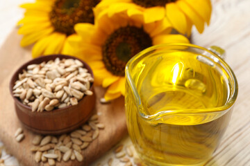 Obraz na płótnie Canvas Sunflower oil in glass jug on table, closeup. Space for text