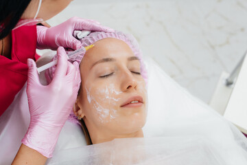 Cosmetic procedure for biorevitalization and removal of wrinkles for a young beautiful girl....