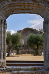 Fototapeta na wymiar Montemor o Novo stone castle ruin entrance gate of old church in Alentejo, Portugal
