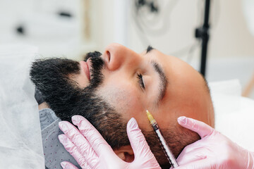 Cosmetic procedure for lip augmentation and wrinkle removal for a bearded man. Cosmetology
