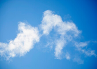 White smoke, steam on the blue sky from  heating plant.