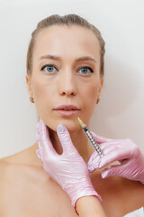 Lip augmentation procedure for a beautiful young girl. Cosmetology