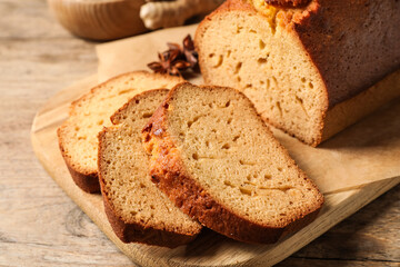 Sliced delicious gingerbread cake on wooden table, closeup