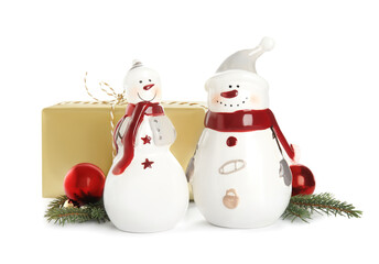 Christmas composition with decorative snowmen and gift box on white background