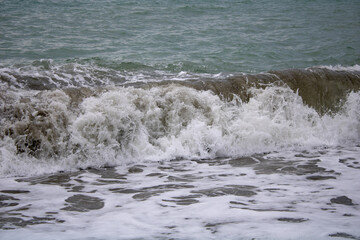 The choppy Black Sea before a storm, Sochi on a warm, cloudy summer day.