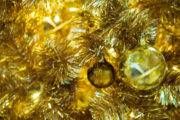 Defocused blurred gold bokeh Christmas tree with ball background for greeting card abstract...