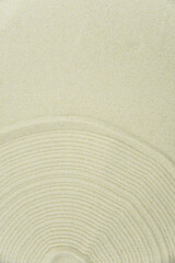 Zen sand garden meditation stone background with copy space. Stones and lines drawing in sand for relaxation. Concept of harmony, balance and meditation, spa, massage, relax. Set Sail Champagne color