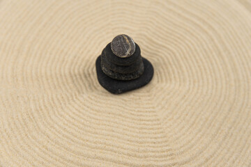 Zen sand garden meditation stone background with copy space. Stones and lines drawing in sand for relaxation. Concept of harmony, balance and meditation, spa, massage, relax. Set Sail Champagne color