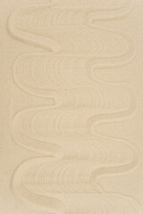 Zen sand garden meditation stone background with copy space. Stones and lines drawing in sand for relaxation. Concept of harmony, balance and meditation, spa, massage, relax. Set Sail Champagne color