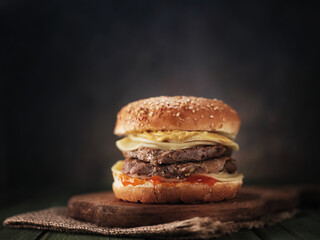 Burger with meat on the table