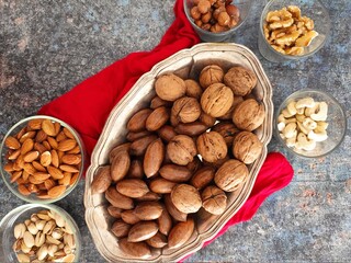 Mixed nuts bowls and a red kitchen towel