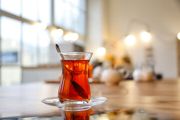 Cup of hot Turkish tea on table