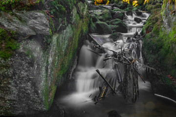 Konsky creek in National park Sumava with cascade and waterfall