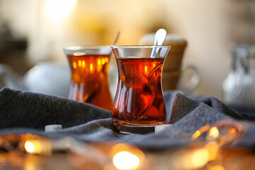 Cups of hot Turkish tea on table