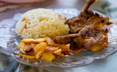 French fries, rice and chicken cutlets