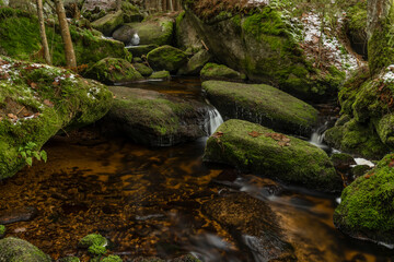 Konsky creek in National park Sumava with cascade and waterfall
