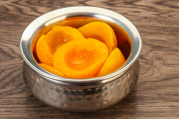 Marinated peaches fruit in the bowl