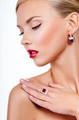 Obraz na płótnie Canvas beautiful woman model with professional makeup, in jewelry. red lipstick