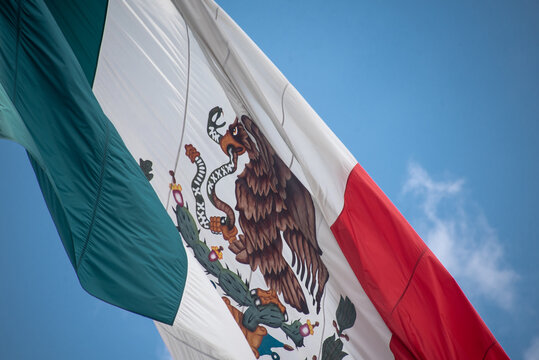 Mexico flag outdoors with blue sky