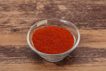 Dry paprika powder in the bowl