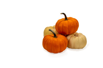 Orange and yellow pumpkins on white background