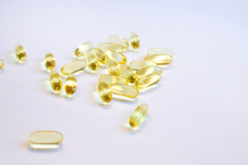 Omega 3 fish oil capsules isolated on a white background