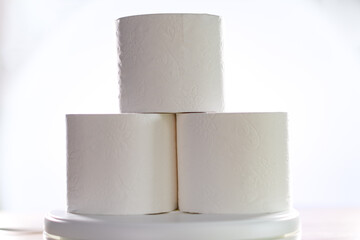 Three rolls of toilet paper so requested in the pandemic, front photo and white background