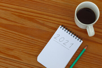 new year's resolutions for 2021 written in notebook on the table