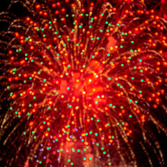 Fireworks light up  at New Year Eve. Abstract Festive background with fireworks sparkles. Copyspace.