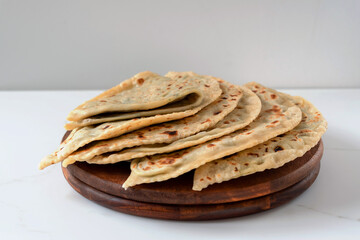 Gozleme or kutabs with herbs and cheese. Or the Dagestani dish chudu - stuffed flat cakes fried in...