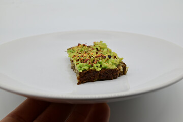 avocado on a black bread