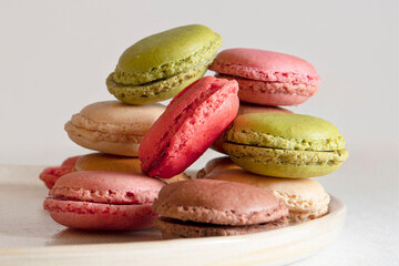 Assortments of coloured macaroons stacked on a plate