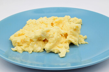 whipped egg on a blue plate