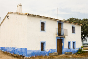 An old country house painted white and blue in Extremadura.