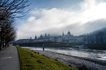 view of the city of salzburg foggy day without fortres