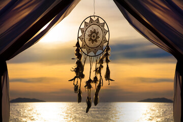 Dream catcher hanging against sun set before night - Powered by Adobe