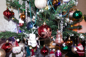 Holiday Christmas and New Year, Christmas tree decorated with different Christmas toys close-up. Winter