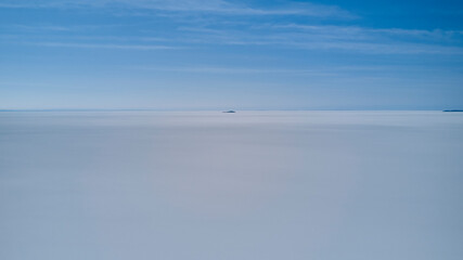 Aerial of Salar de Uyuni, Salar de Tunupa, worlds largest salt flat, in the altiplano of Bolivia in the andes mountains. Worlds biggest lithium source and popular travel destination in South America