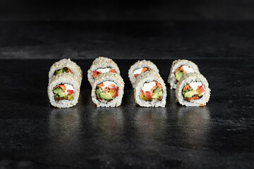 Sushi Rolls. Sushi Rolls Set, maki, philadelphia and california rolls, on a Black background.
