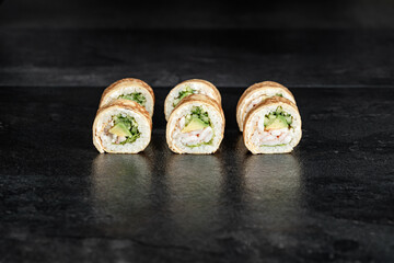 Sushi Rolls. Sushi Rolls Set, maki, philadelphia and california rolls, on a Black background.