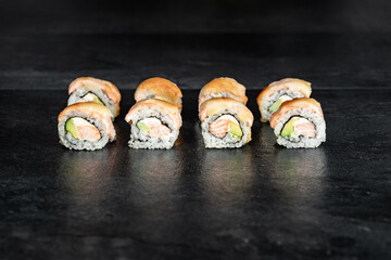 Sushi Rolls. Sushi Rolls Set, maki, philadelphia and california rolls, on a Black background.